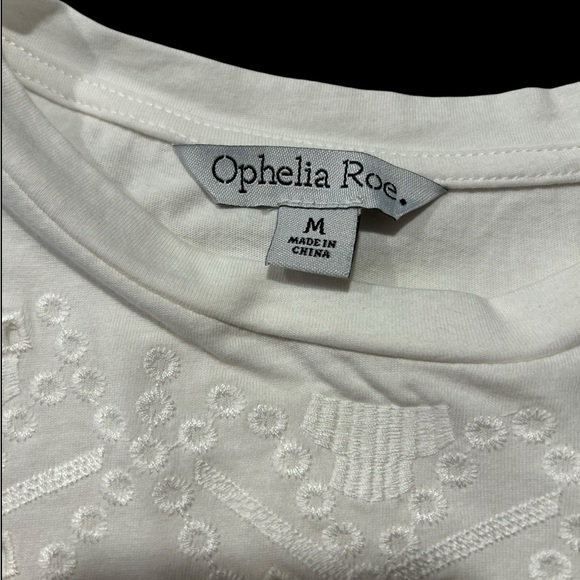 An Ophelia Roe short sleeved white pullover blouse with top and sleeve eyelets - Picture 4 of 8